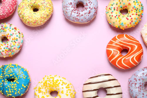 Delicious glazed donuts on lilac background, flat lay. Space for text