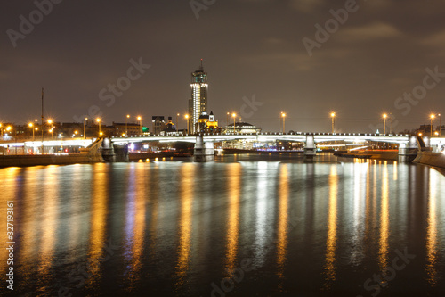 Night view of the Novospassky bridge  the reflection of city lights in the river.