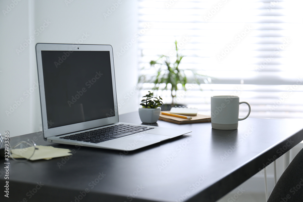 Modern laptop on office table. Stylish workplace Modern laptop on office table. Stylish workplace