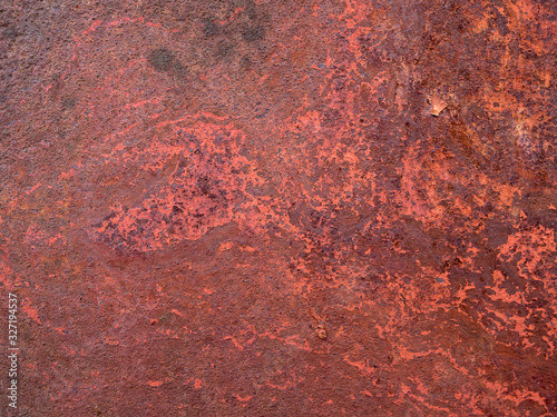 Rusty reddish surface of metal plate