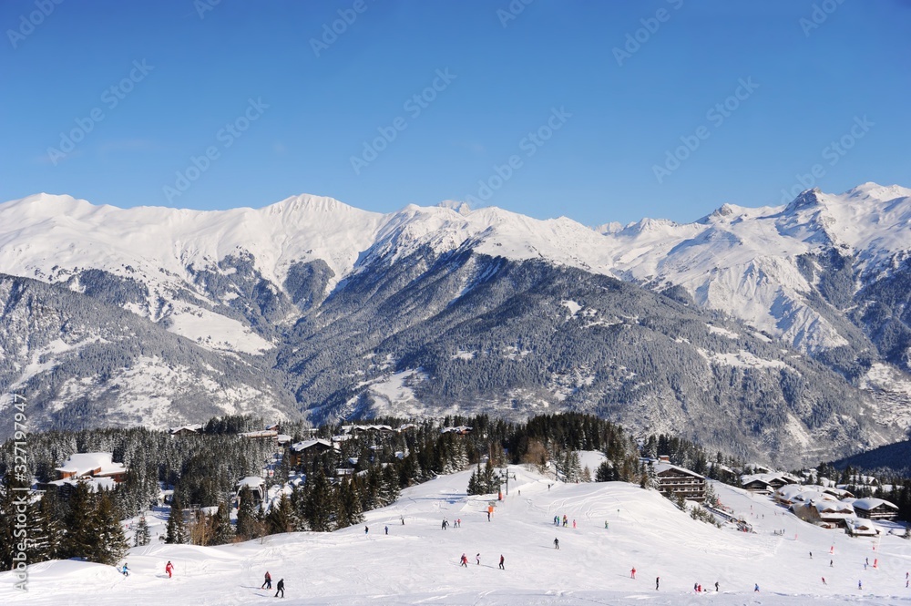 Ski resort Courchevel in winter with snowy mountains and ski slopes 