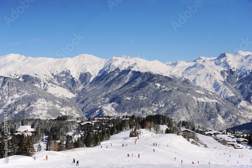 Ski resort Courchevel in winter with snowy mountains and ski slopes  © raeva