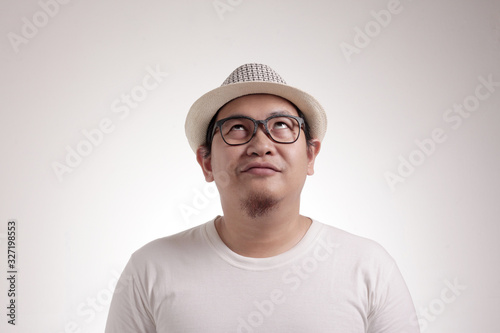 Young Man Thinking and Looking Up, Having Good Idea