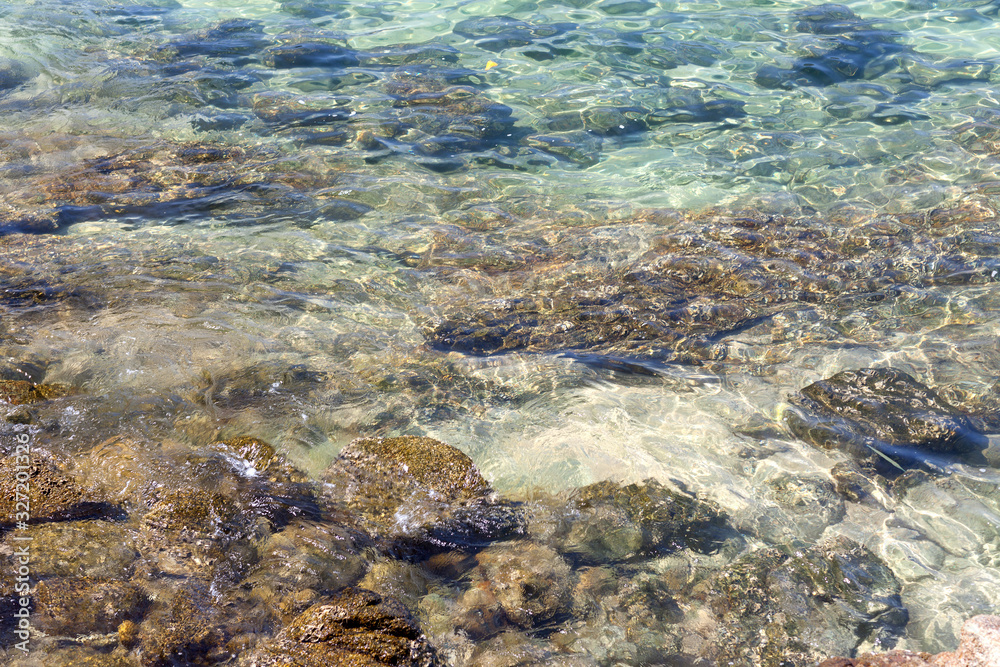 Clear, clear seawater covering the stones. Clear, clear seawater covering the stones.