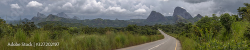 Panorama view of a road on the tropical landscape, with forest and mountains Kumbira forest reserve in Angola photo