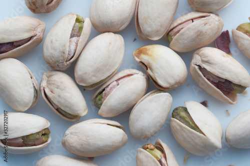close up of raw and fresh pistachios on table 