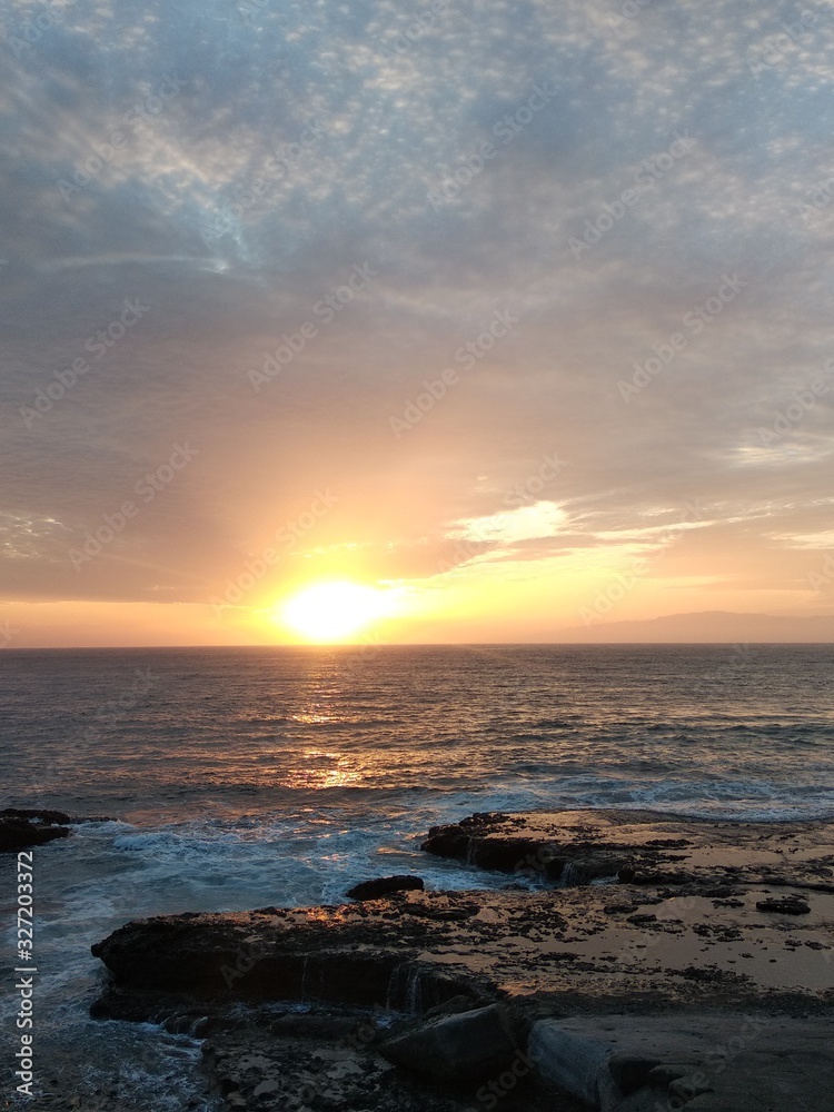 View of a beautiful volcanic sandy beach at sunset, Tenerife island, Canary Islands, Spain