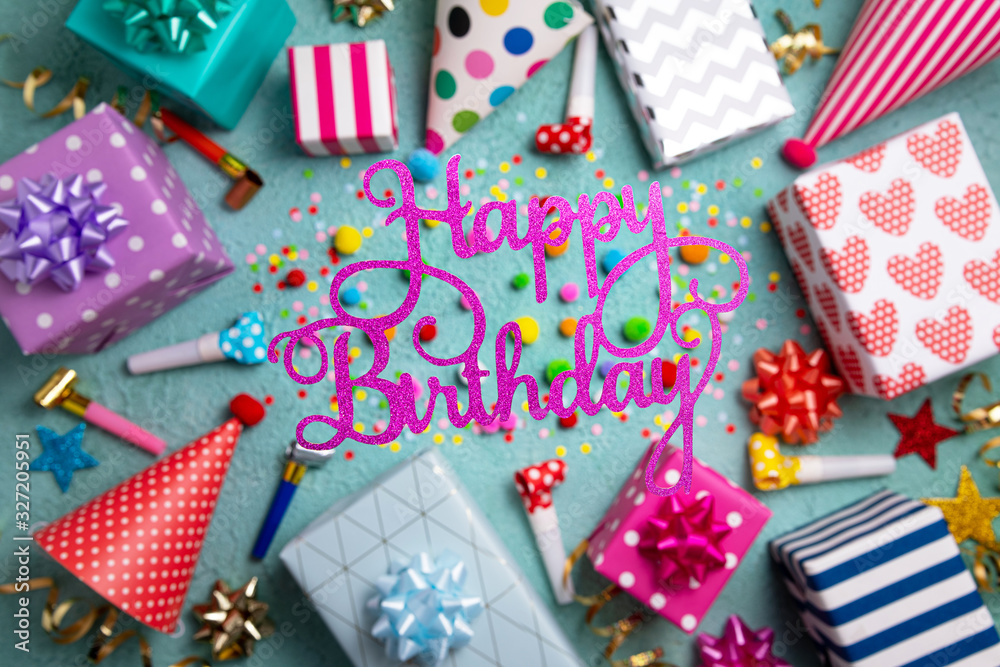 Obraz premium Happy birthday greeting card. Party background with colorful party accessories. Happy birthday background. Top view, flat lay