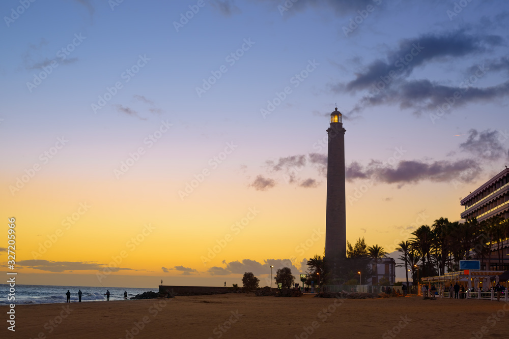 Beautiful view of Maspalomas lighthouse (El Faro de Maspalomas) at the Maspalomas beach after sunset. The old lighthouse at the southern part of Gran Canaria Island, Spain