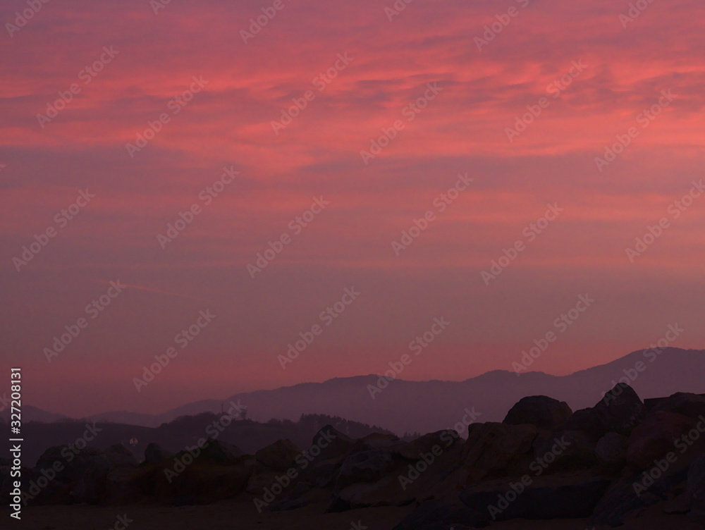 Red sunset on a hilly landscape