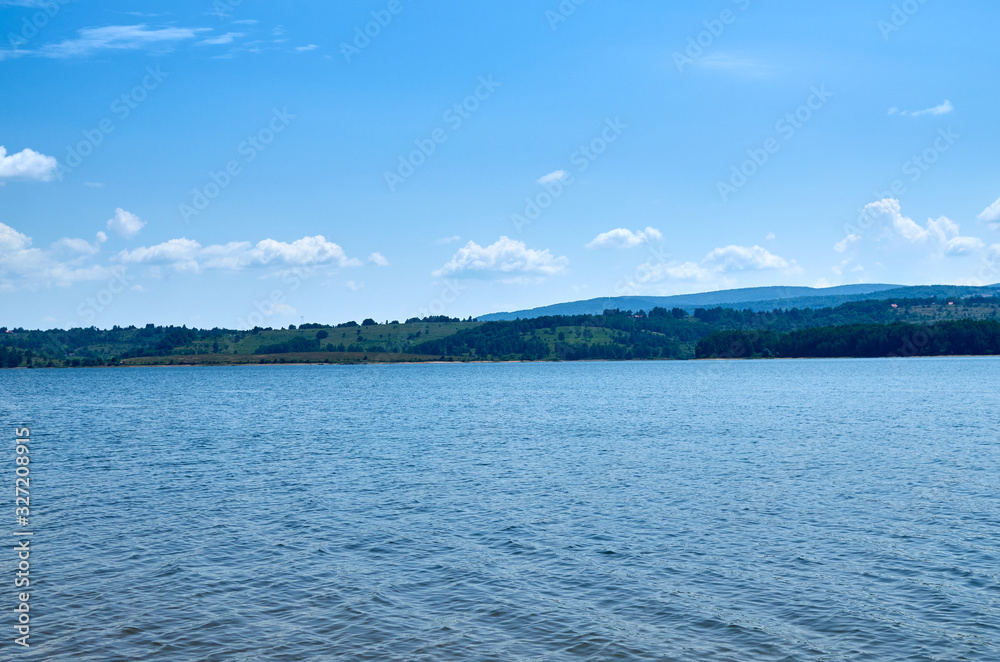 Vlasina lake in Serbia and picturesque hills in distance in summer