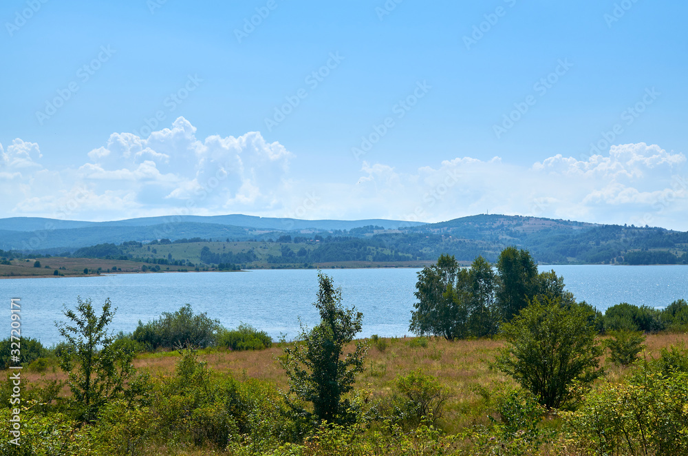 Lake and its picturesque shores in summer