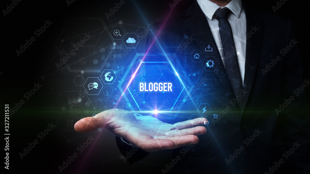 Naklejka premium Man hand holding BLOGGER inscription, social media concept