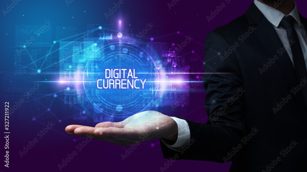 Man hand holding DIGITAL CURRENCY inscription, technology concept Man hand holding DIGITAL CURRENCY inscription, technology concept