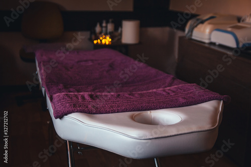 Place for relaxation in modern wellness and spa center with purple towels