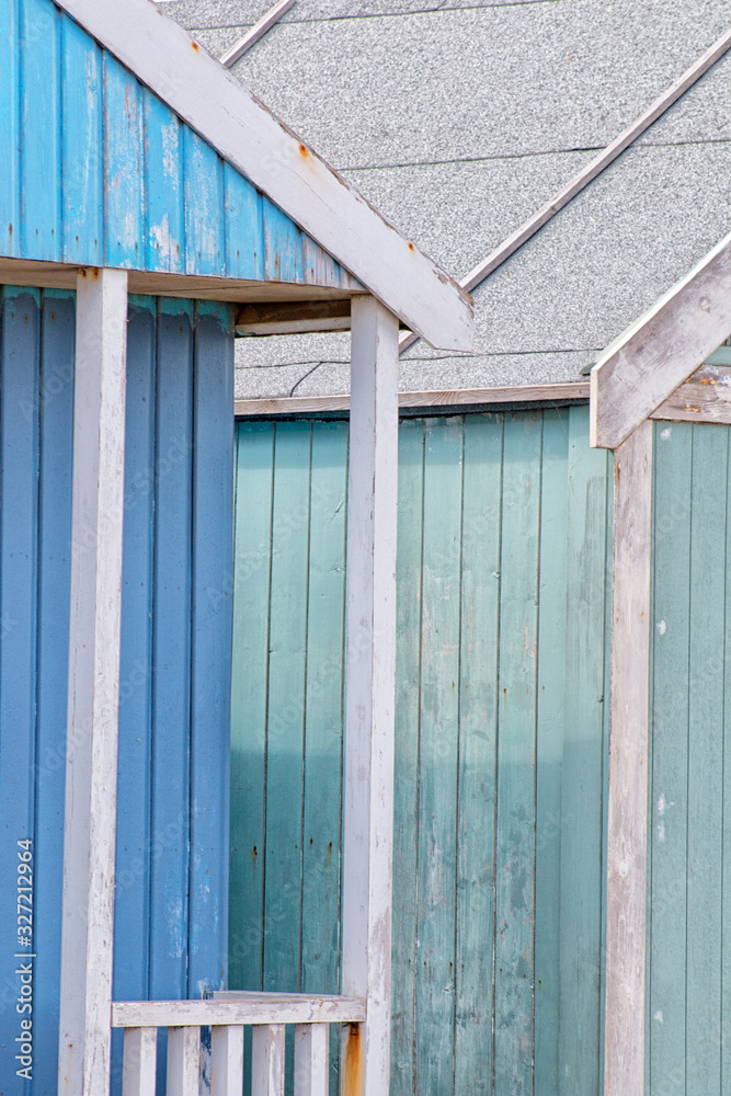 Abstract view of Beach huts. Sutton on Sea beach hut juxtaposition of colours and structure of huts. Various colours in vivid shades and brightness. Summertime holiday resort. Abstract view of Beach huts. Sutton on Sea beach hut juxtaposition of colours and structure of huts. Various colours in vivid shades and brightness. Summertime holiday resort.