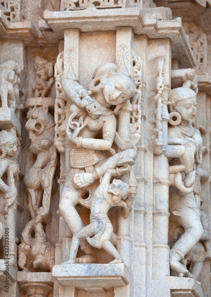 Bas-relief with dancing Apsaras and Surasundaris of famous Neminath Jain temple in Ranakpur, Rajasthan state of India