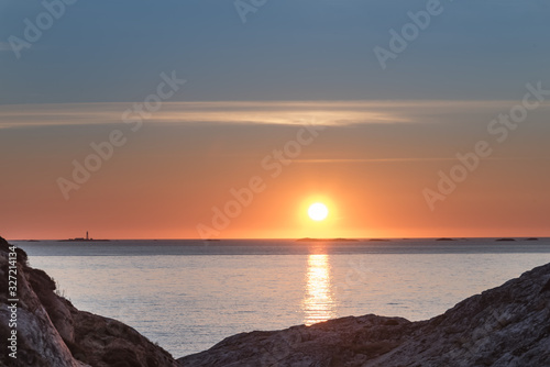 North port of Marstrand at sunset between cliff