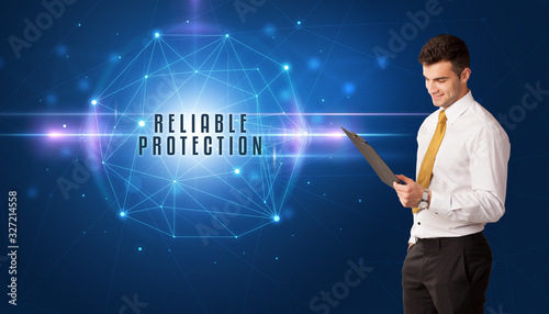 Businessman thinking about security solutions with RELIABLE PROTECTION inscription