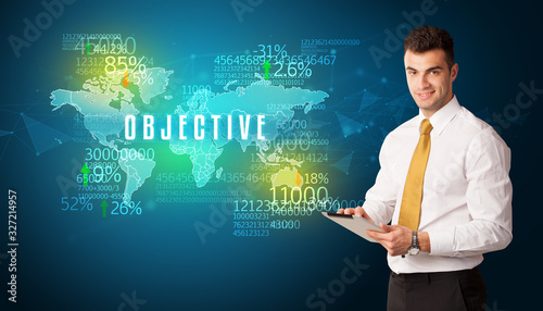 Businessman in front of a decision with OBJECTIVE inscription  business concept