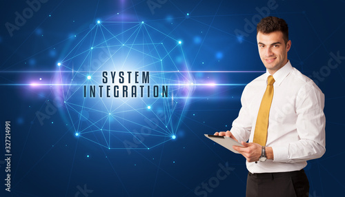 Businessman thinking about security solutions with SYSTEM INTEGRATION inscription