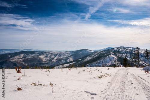 Fototapeta Naklejka Na Ścianę i Meble -  Winter landscape in mountains at sunshine day with beautiful clouds, Poland Beskids