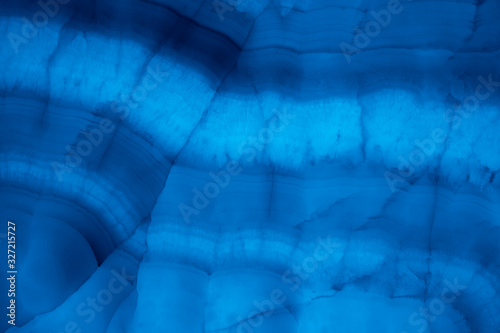 Abstract marble background in blue trendy colors. Texture of marble surface. Place for design. Close up. Color of the year 2020.
