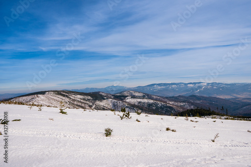 Fototapeta Naklejka Na Ścianę i Meble -  Winter landscape in mountains at sunshine day with beautiful clouds, Poland Beskids