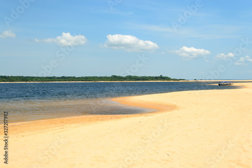 Interesting and particular river landscape in Brazil  in the state of Par  . A beach of clear sand and varying tongues of land depending on the movements of the water on the Amazon River.