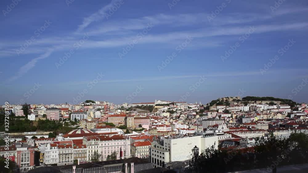 View of Lisbon orange roof white building city during sunset, Portugal View of Lisbon orange roof white building city during sunset, Portugal