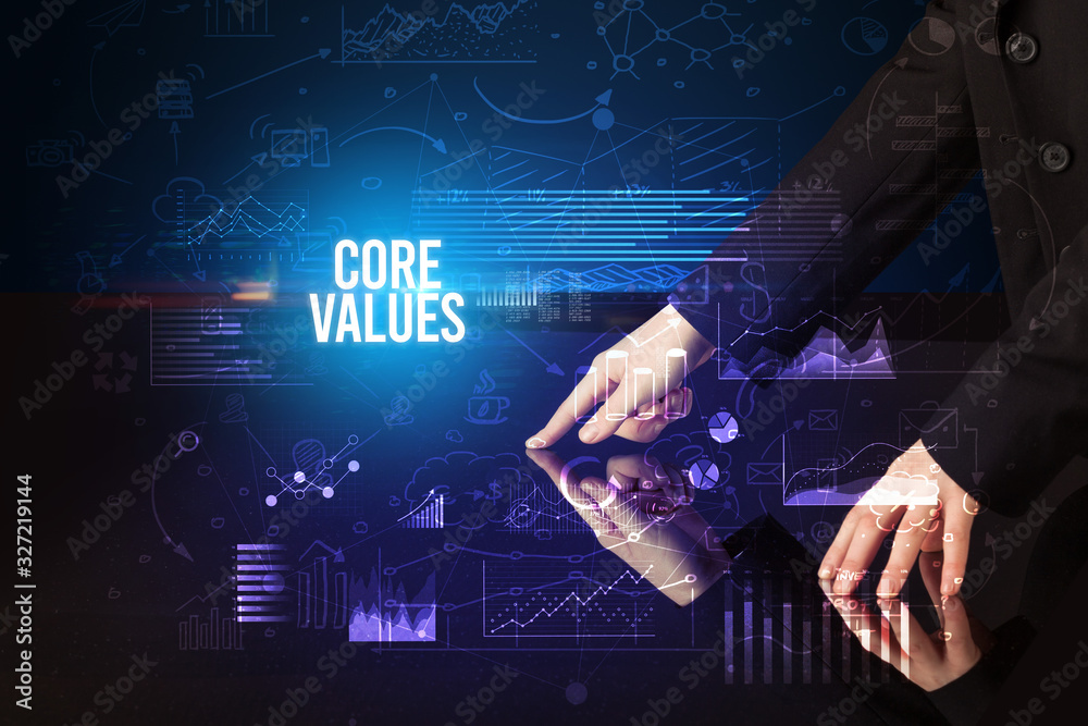 Businessman touching huge screen with CORE VALUES inscription, cyber business concept