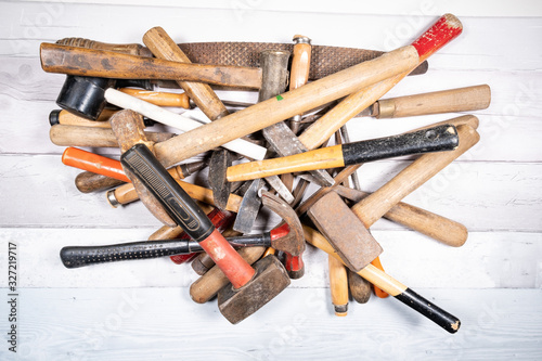 Wallpaper Mural Sets of different wood rasps, hammers and wood chisels in the middle of an old wooden floor background. top view Torontodigital.ca