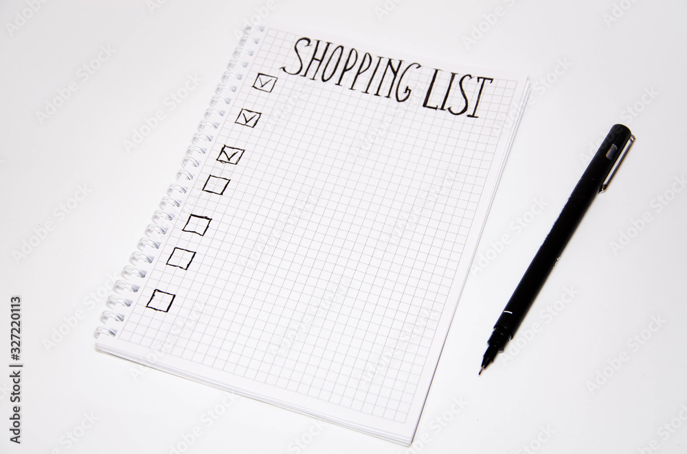 Shopping list. Squared notebook with black pen on a white background. Record ideas, notes, plans, tasks. The list includes bread, milk, bananas. Copy Spase Shopping list. Squared notebook with black pen on a white background. Record ideas, notes, plans, tasks. The list includes bread, milk, bananas. Copy Spase