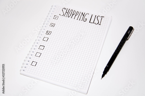 Wallpaper Mural Shopping list. Squared notebook with black pen on a white background. Record ideas, notes, plans, tasks. The list includes bread, milk, bananas.  Copy Spase Torontodigital.ca
