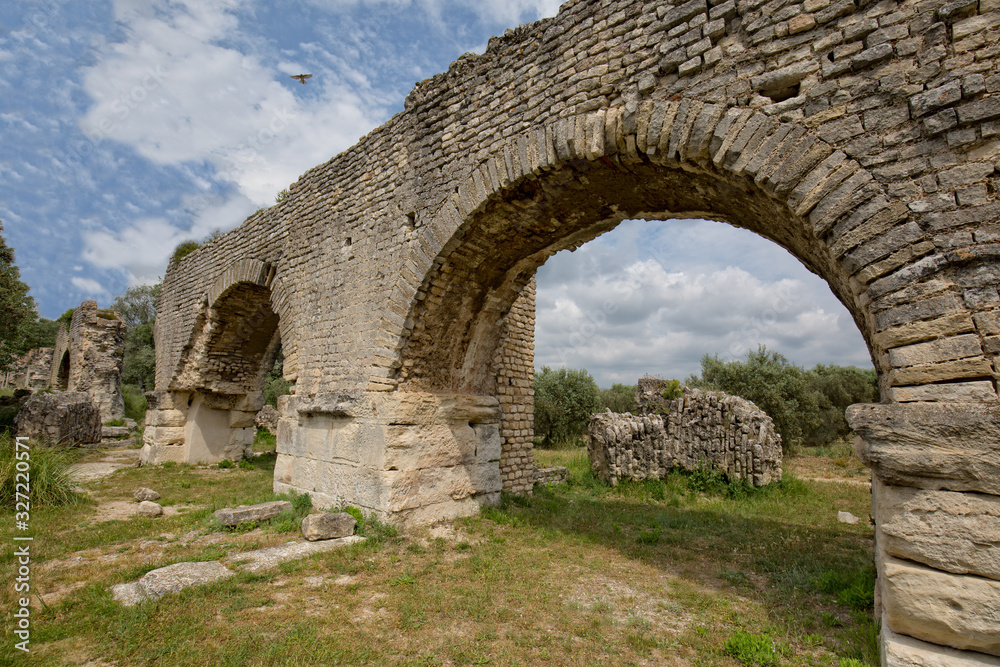 The Historical Monument Aqueduct Romain de Barbegal. The Barbegal aqueduct and mills constitute a Roman complex of hydraulic milling located in Fontvieille, near the town of Arles, Provence, France