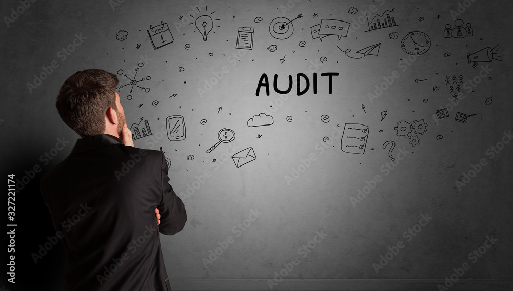 businessman drawing a creative idea sketch with AUDIT inscription, business strategy concept businessman drawing a creative idea sketch with AUDIT inscription, business strategy concept
