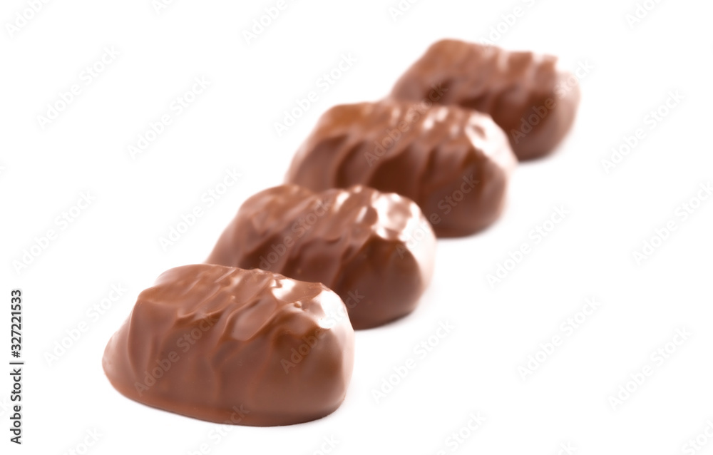 Five Milk Chocolate Truffles in a Row on a White Background Five Milk Chocolate Truffles in a Row on a White Background