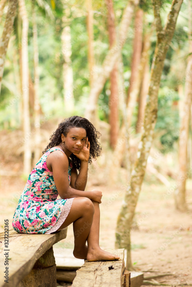 Portraits of a beautiful young black woman with beautiful curly hair. Brazilian Portraits of a beautiful young black woman with beautiful curly hair. Brazilian