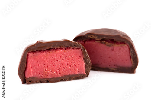 Chocolate Red Raspberry Truffle Cut Open and Isolated on a White Background
