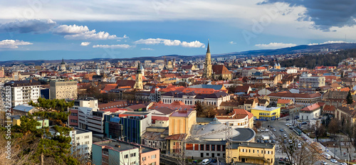 Aerial panoramic view of Cluj Napoca city over the famous cultural landmarks in town in a daytime , Romania photo