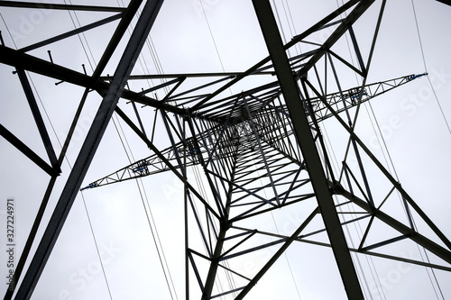 an electricity pylon from below horizontal