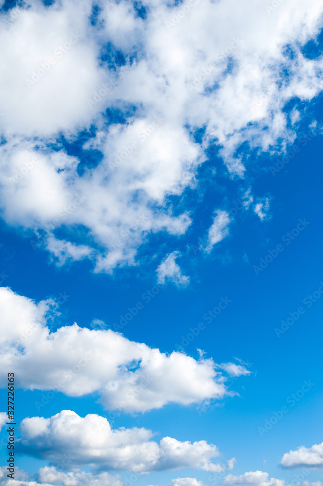 Fototapeta premium beautiful white clouds in bright blue sky on the nice day