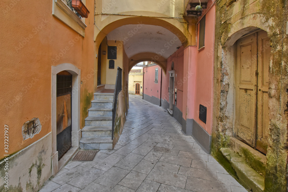 Sant'Agata de 'Goti, Italy, 02/29/2020. A narrow street between old houses of a medieval village.