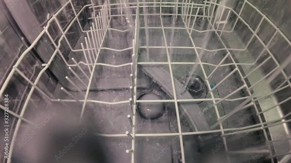 The master repairs the dishwasher and checks the operation of the