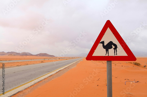 camel warning sign on desert highway in Jordan