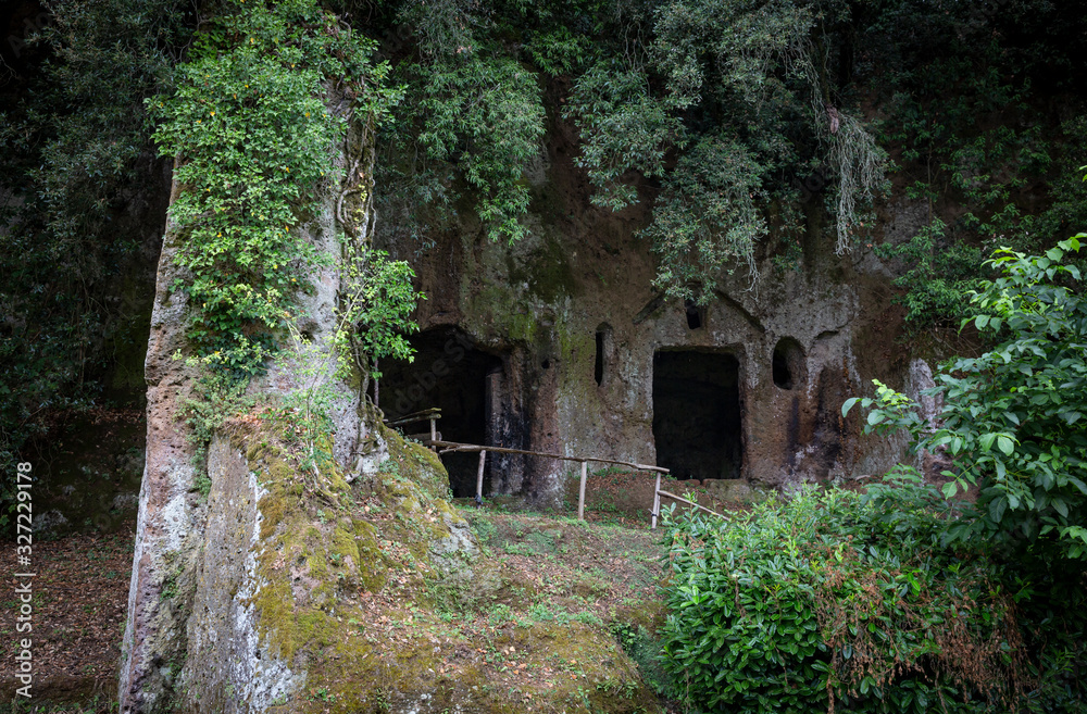 Etruscan necropolis with tombs hollowed out of red tuff rock in Sutri, province of Viterbo, Lazio, Italy Etruscan necropolis with tombs hollowed out of red tuff rock in Sutri, province of Viterbo, Lazio, Italy