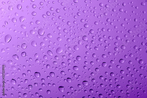 water drops on a violet glass