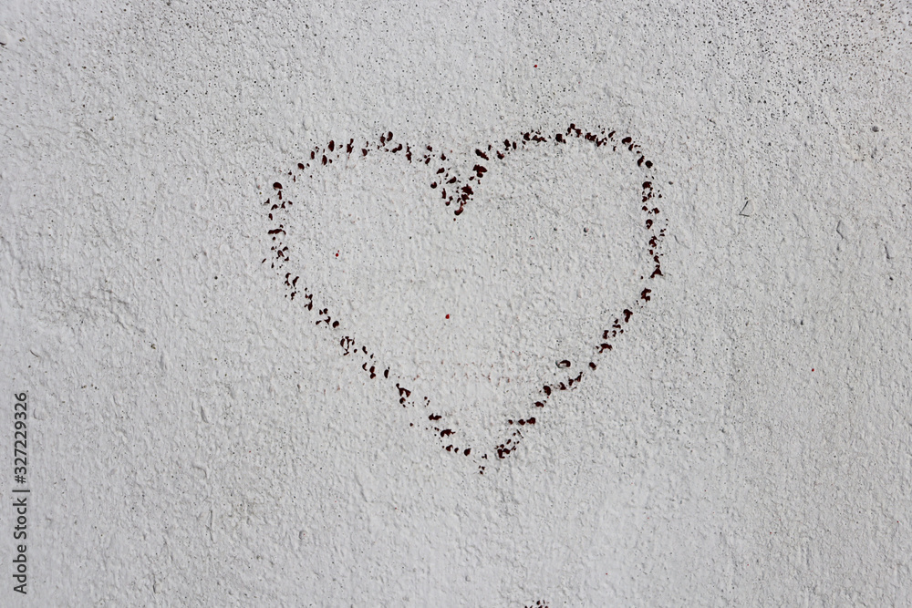 Vintage drawing of a heart on a white wall