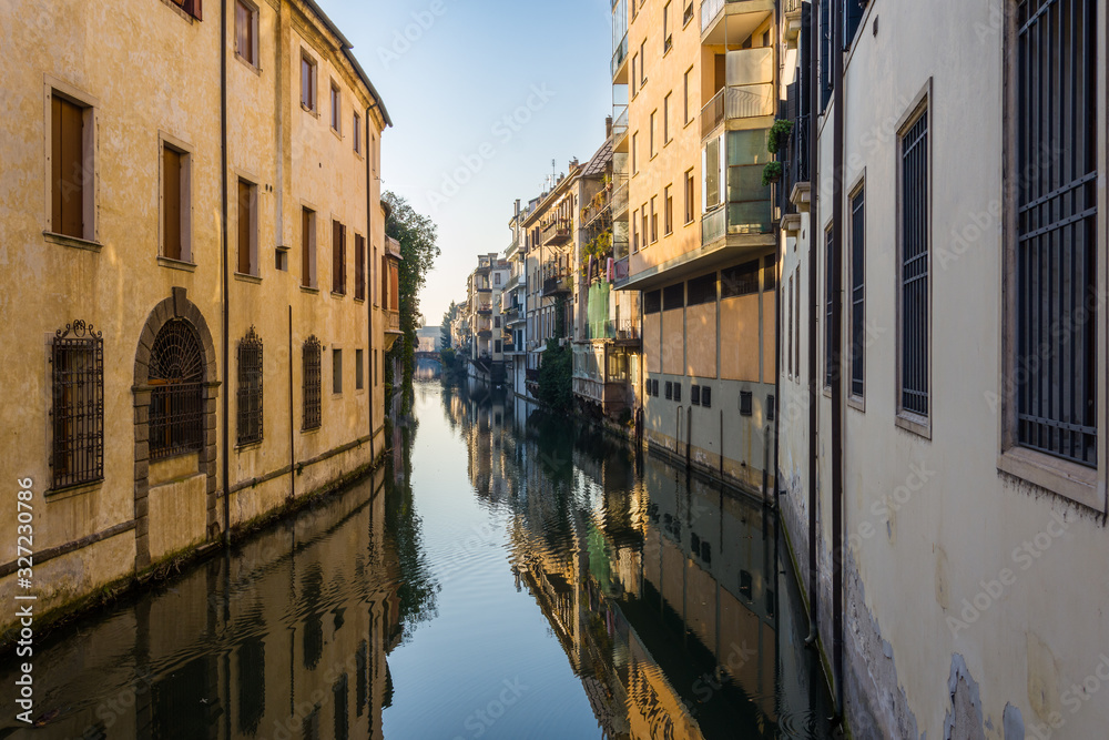 Reflections of the houses on the canal that crosses Padova