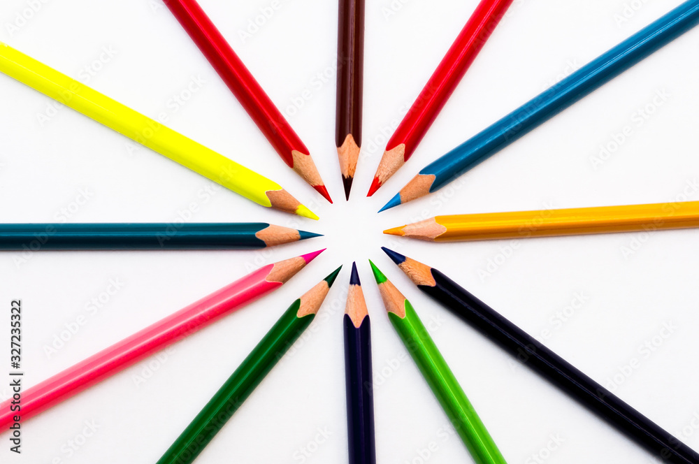 colored pencils point to the center of the frame on a white background and contains empty space for your text colored pencils point to the center of the frame on a white background and contains empty space for your text